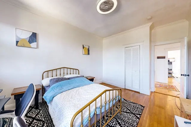 a bedroom with a bed and a table in it