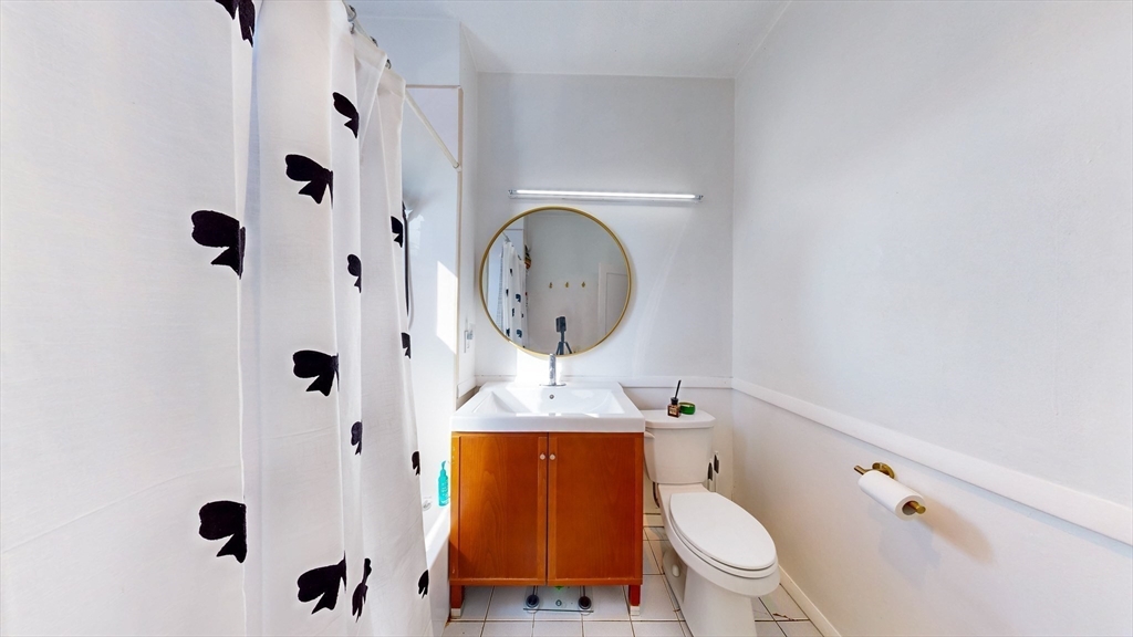 110 Bellingham Street, Unit 3 Chelsea, MA 02150 - Photo 22 of 26 a bathroom with a toilet and a shower