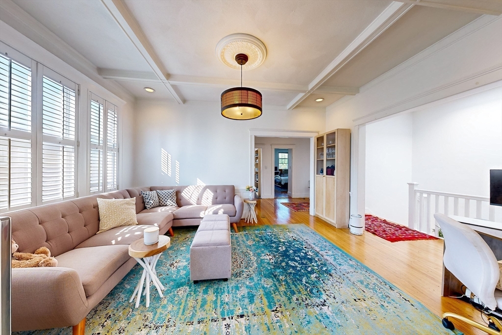 110 Bellingham Street, Unit 3 Chelsea, MA 02150 - Photo 4 of 26 a living room with furniture and a large window
