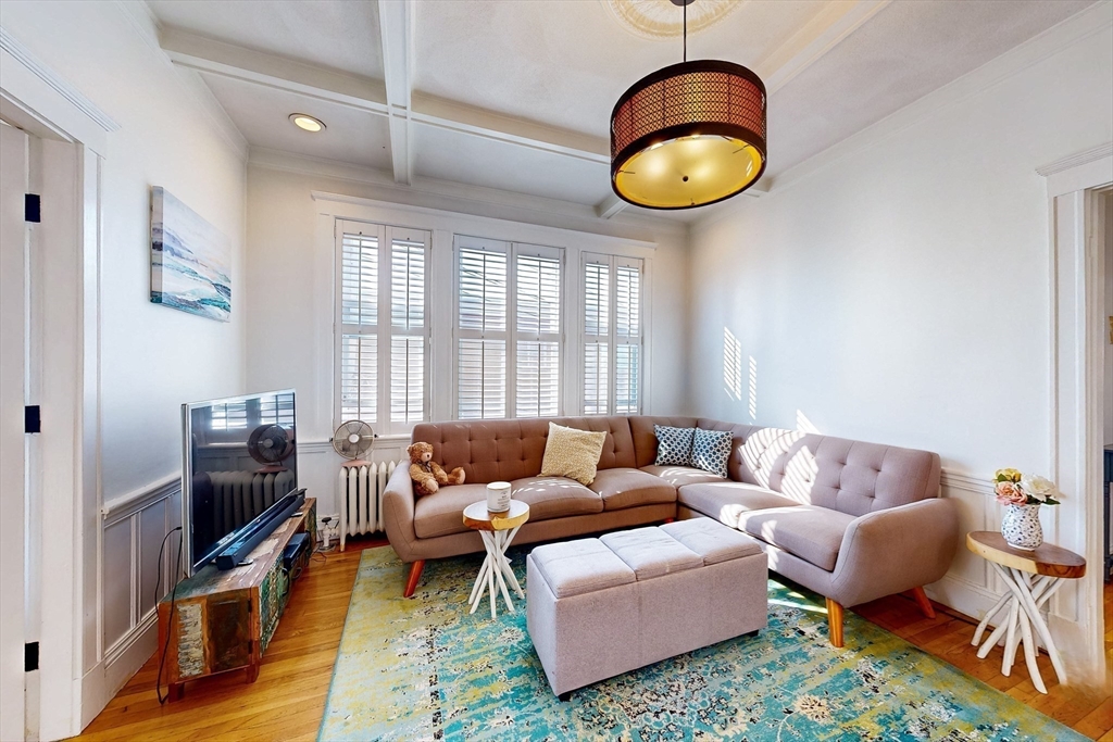 110 Bellingham Street, Unit 3 Chelsea, MA 02150 - Photo 6 of 26 a living room with furniture a rug and a window