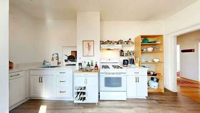 a view of cabinets and wooden floor
