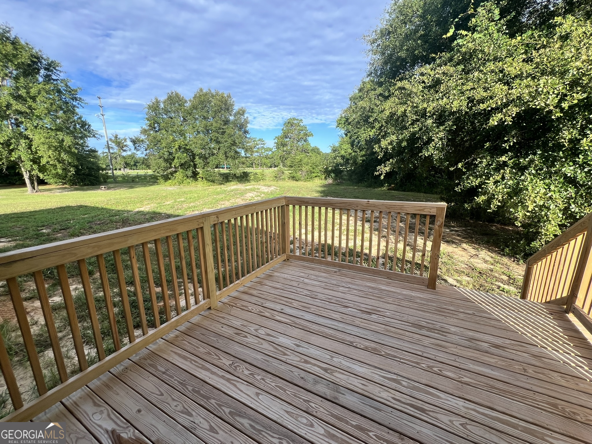 120 Caleb Circle Jesup, GA 31545 - Photo 20 of 22 a view of balcony with wooden floor and fence