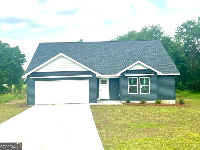 a house with trees in the background
