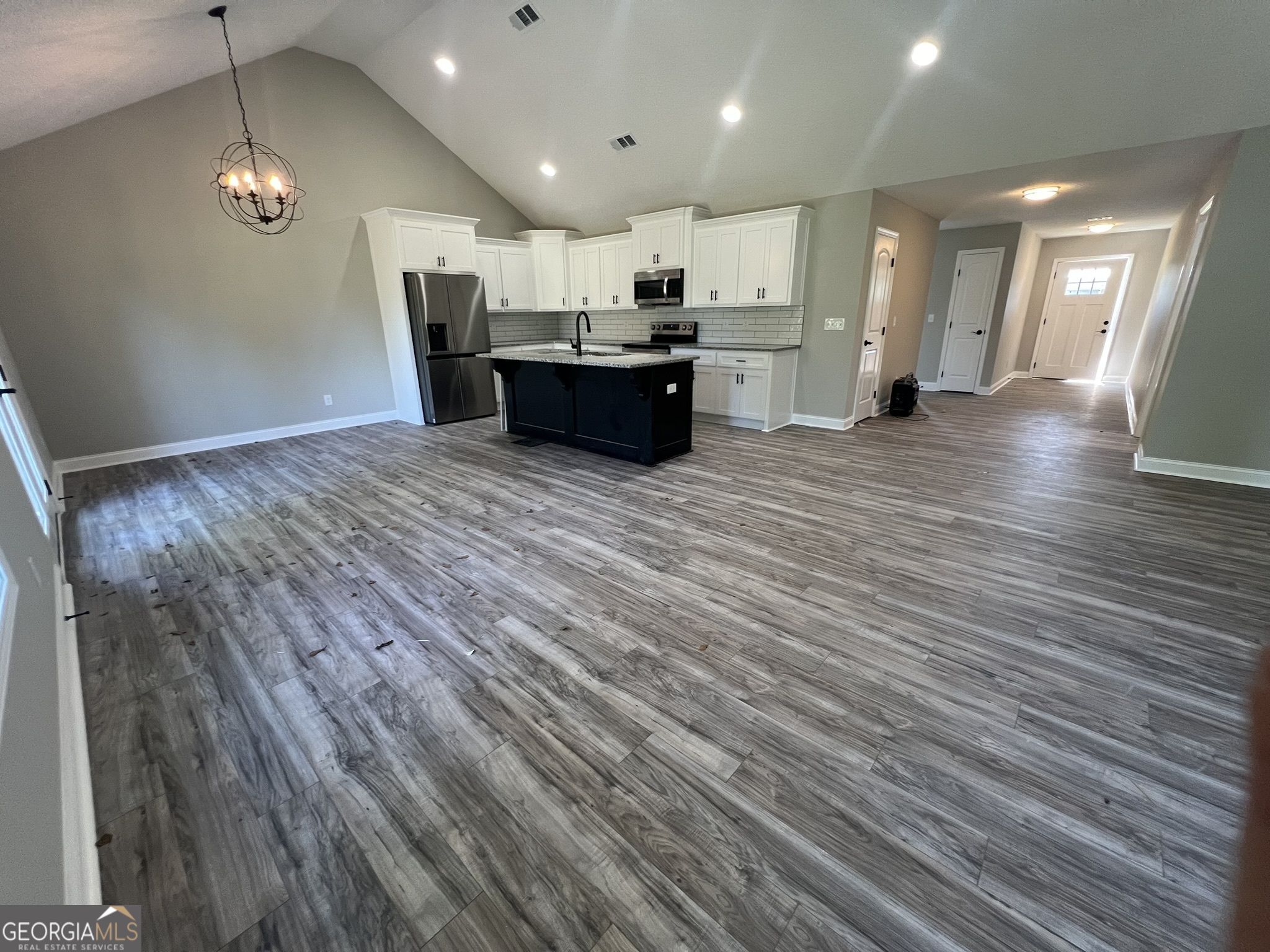 120 Caleb Circle Jesup, GA 31545 - Photo 3 of 22 a view of a kitchen with a sink and a refrigerator