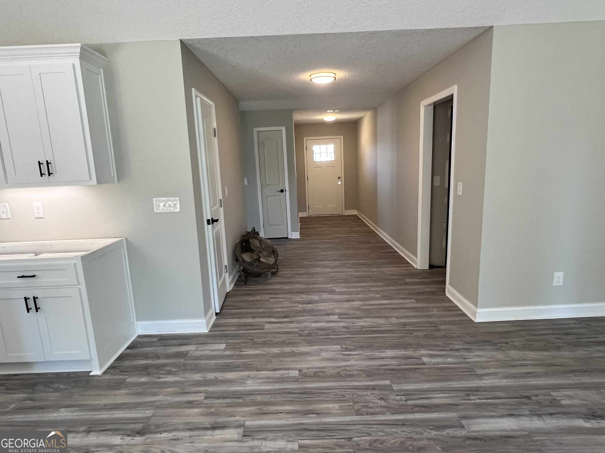 120 Caleb Circle Jesup, GA 31545 - Photo 9 of 22 a view of a hallway with wooden floor