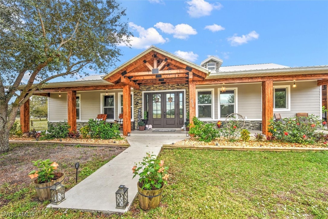 2010 Frontier Circle LaBelle, FL 33935 - Photo 3 of 35 a front view of a house with a yard