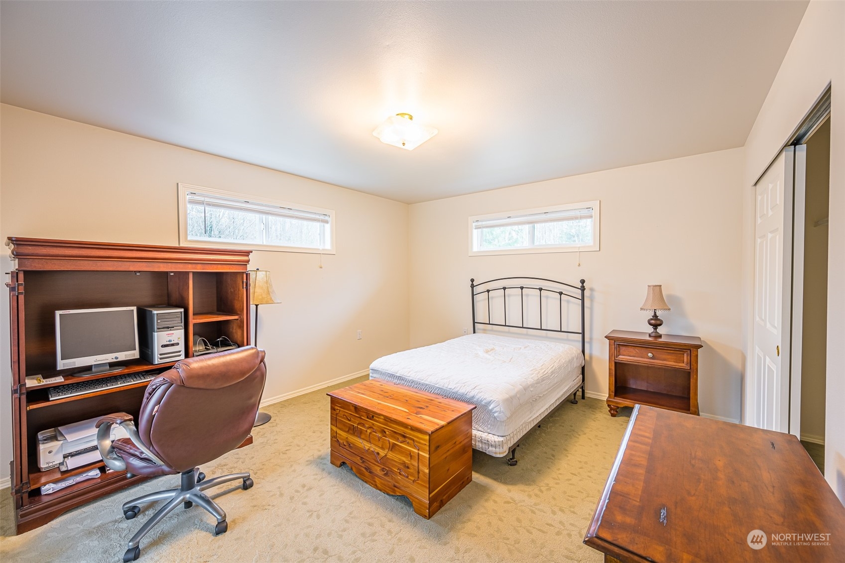 1545 Ripley Creek Road Quilcene, WA 98376 - Photo 13 of 23 a bedroom with a bed and wooden floor