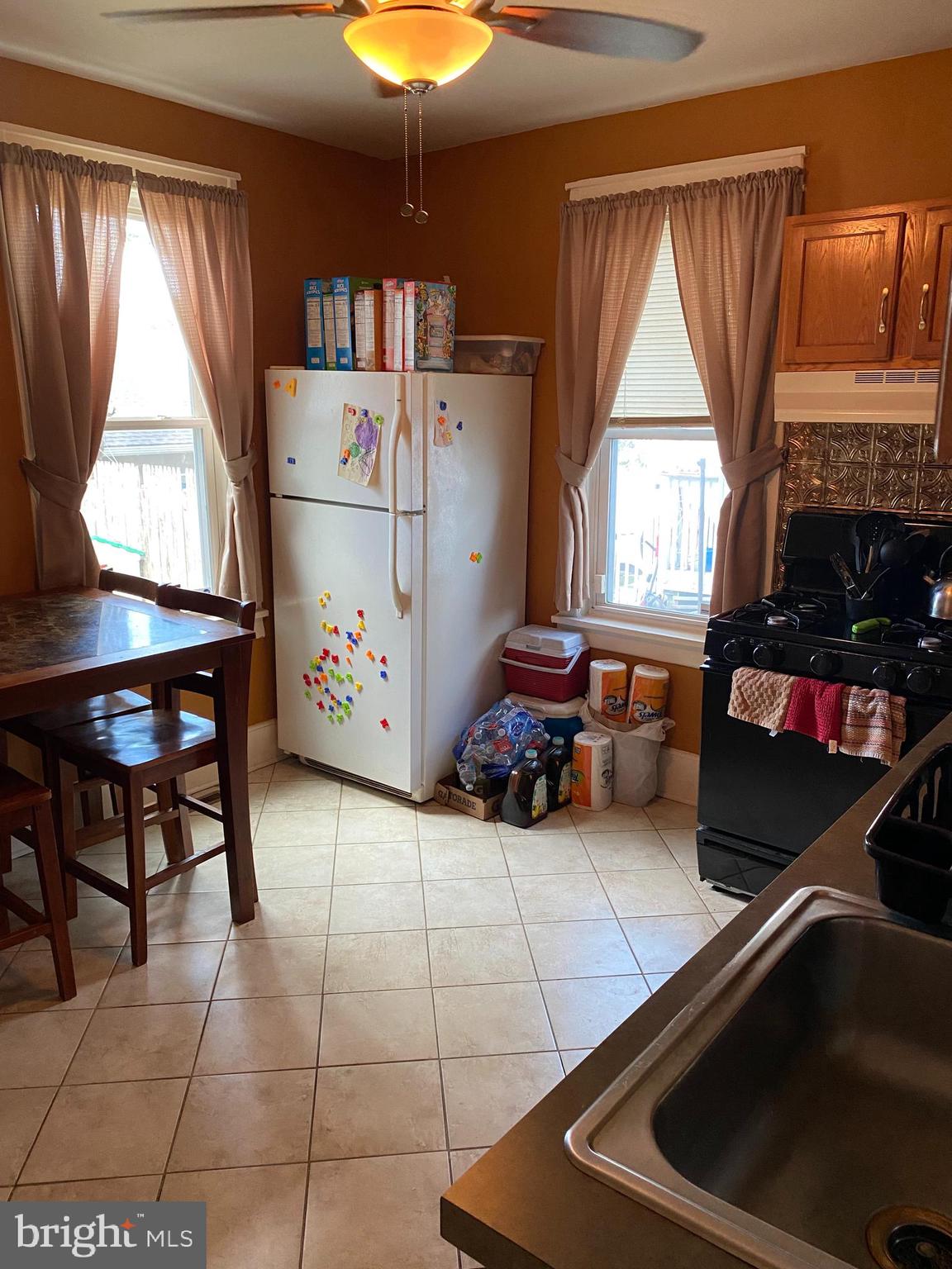 527 Bridgeboro Street Riverside, NJ 08075 - Photo 11 of 20 a kitchen with a window a table and chairs in it