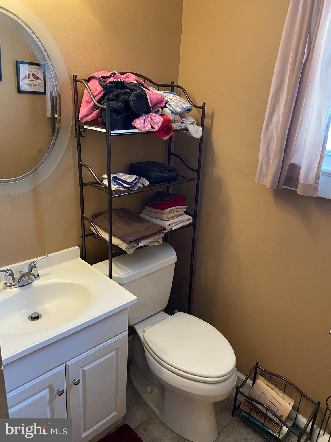 527 Bridgeboro Street Riverside, NJ 08075 - Photo 13 of 20 a bathroom with a sink a toilet and a mirror