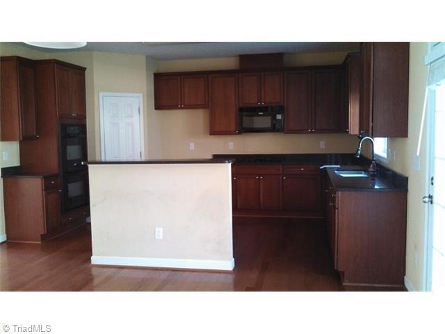 4637 River Valley Road High Point, NC 27265 - Photo 2 of 11 Kitchen. Kitchen with granite counters, wall oven, gas range top and a pantry.