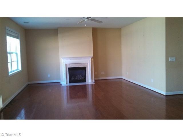 4637 River Valley Road High Point, NC 27265 - Photo 3 of 11 Den/Family/Great Room. Den with fireplace with gas logs, built in desk area and wood floors and windows overlooking the wooded back yard.