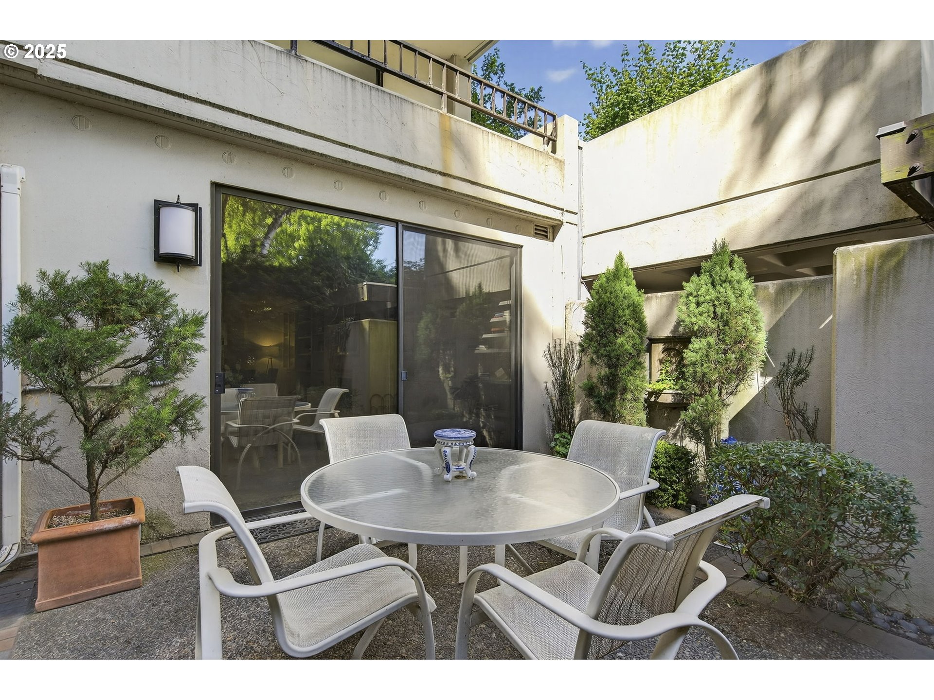 2309 Southwest 1st Avenue, Unit G41 Portland, OR 97201 - Photo 21 of 44 a patio with yard glass top table and chairs
