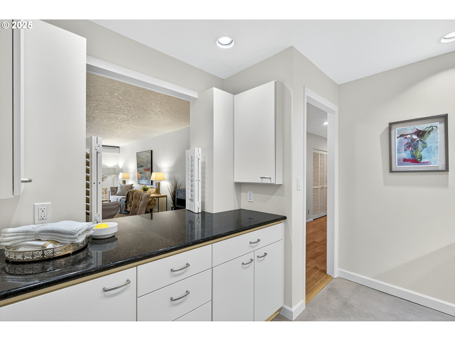 2309 Southwest 1st Avenue, Unit G41 Portland, OR 97201 - Photo 24 of 44 a bathroom with a granite countertop sink and a mirror