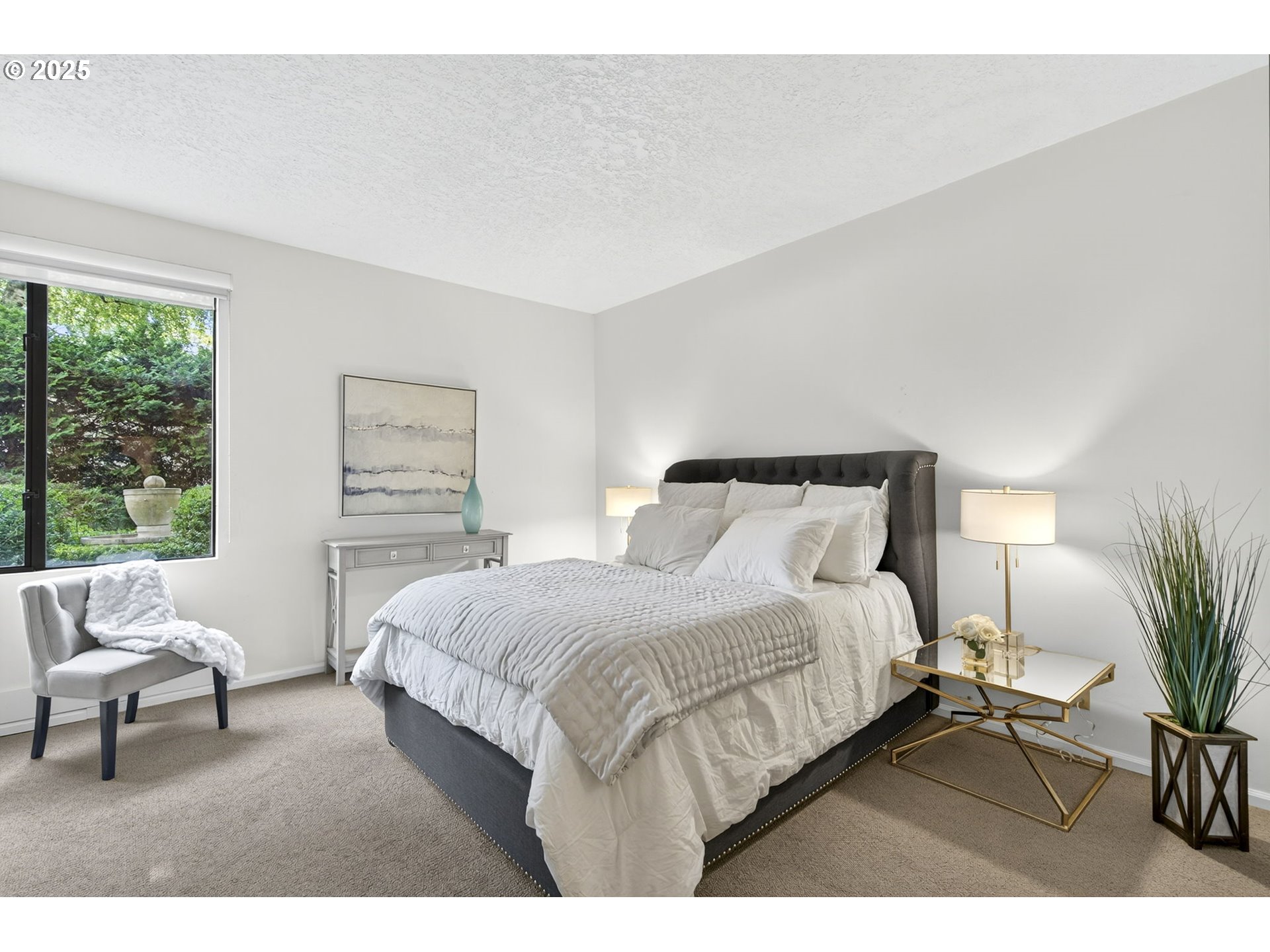 2309 Southwest 1st Avenue, Unit G41 Portland, OR 97201 - Photo 28 of 44 a bedroom with a large bed and a couch