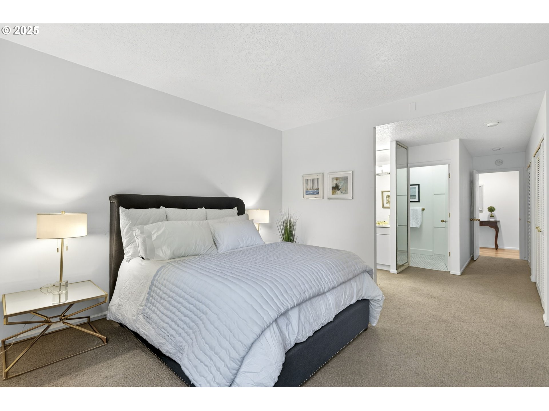 2309 Southwest 1st Avenue, Unit G41 Portland, OR 97201 - Photo 30 of 44 a bedroom with a bed and a lamp