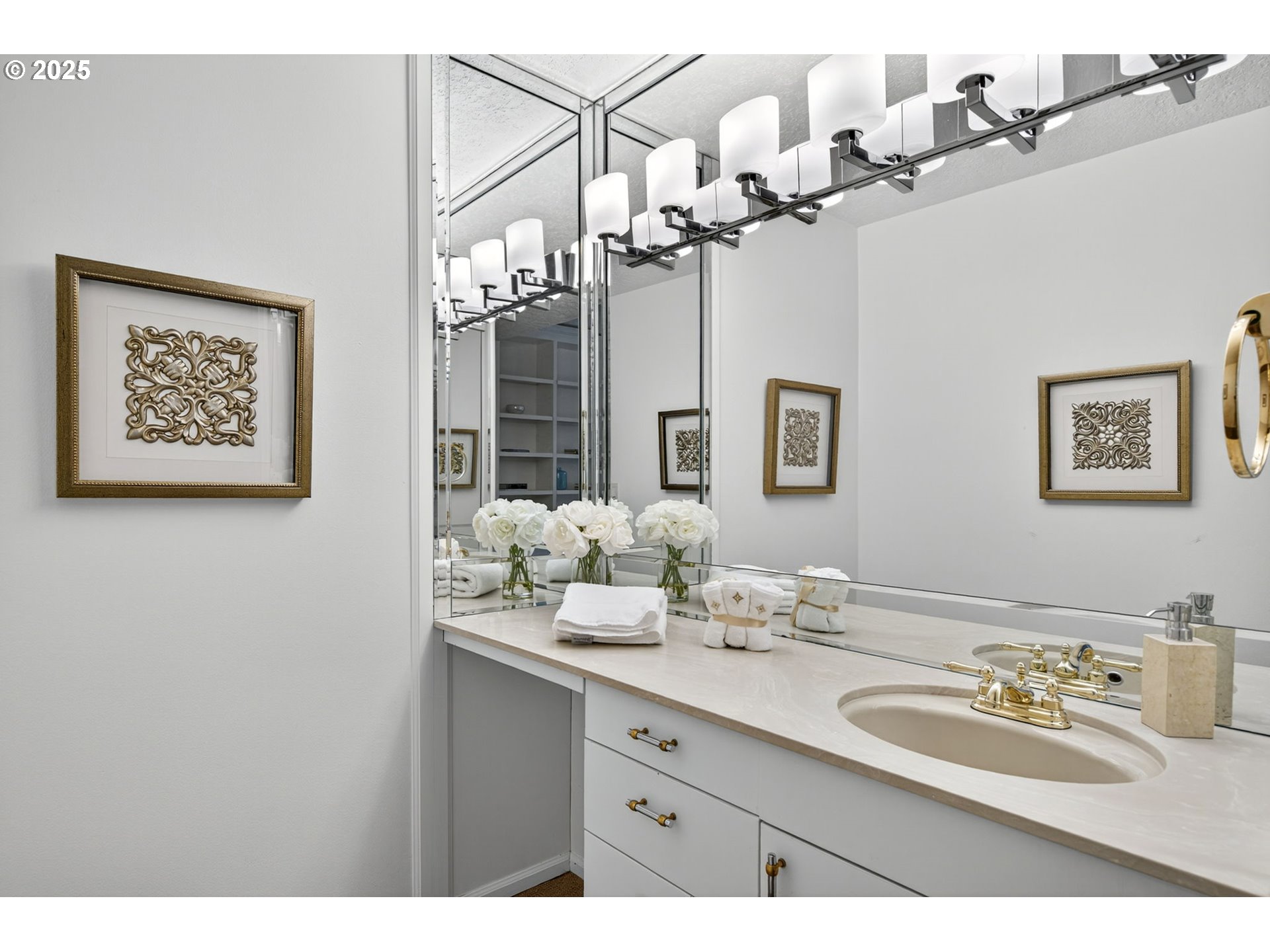 2309 Southwest 1st Avenue, Unit G41 Portland, OR 97201 - Photo 32 of 44 a bathroom with a granite countertop sink a large mirror and flowers