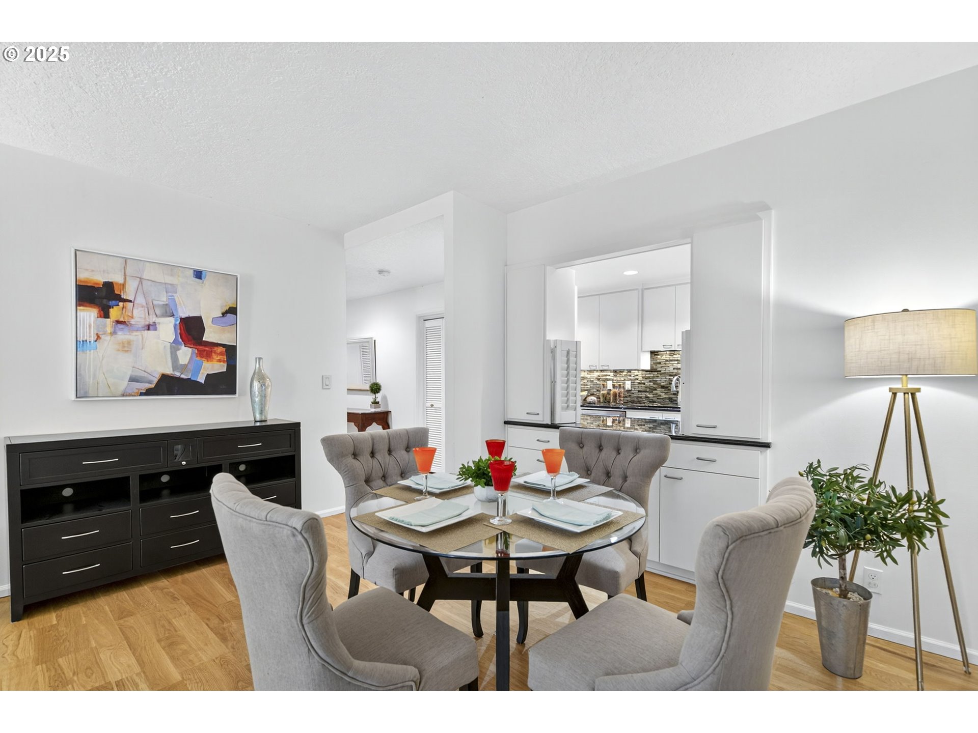 2309 Southwest 1st Avenue, Unit G41 Portland, OR 97201 - Photo 9 of 44 a living room with dining table a dining table and chairs with kitchen view