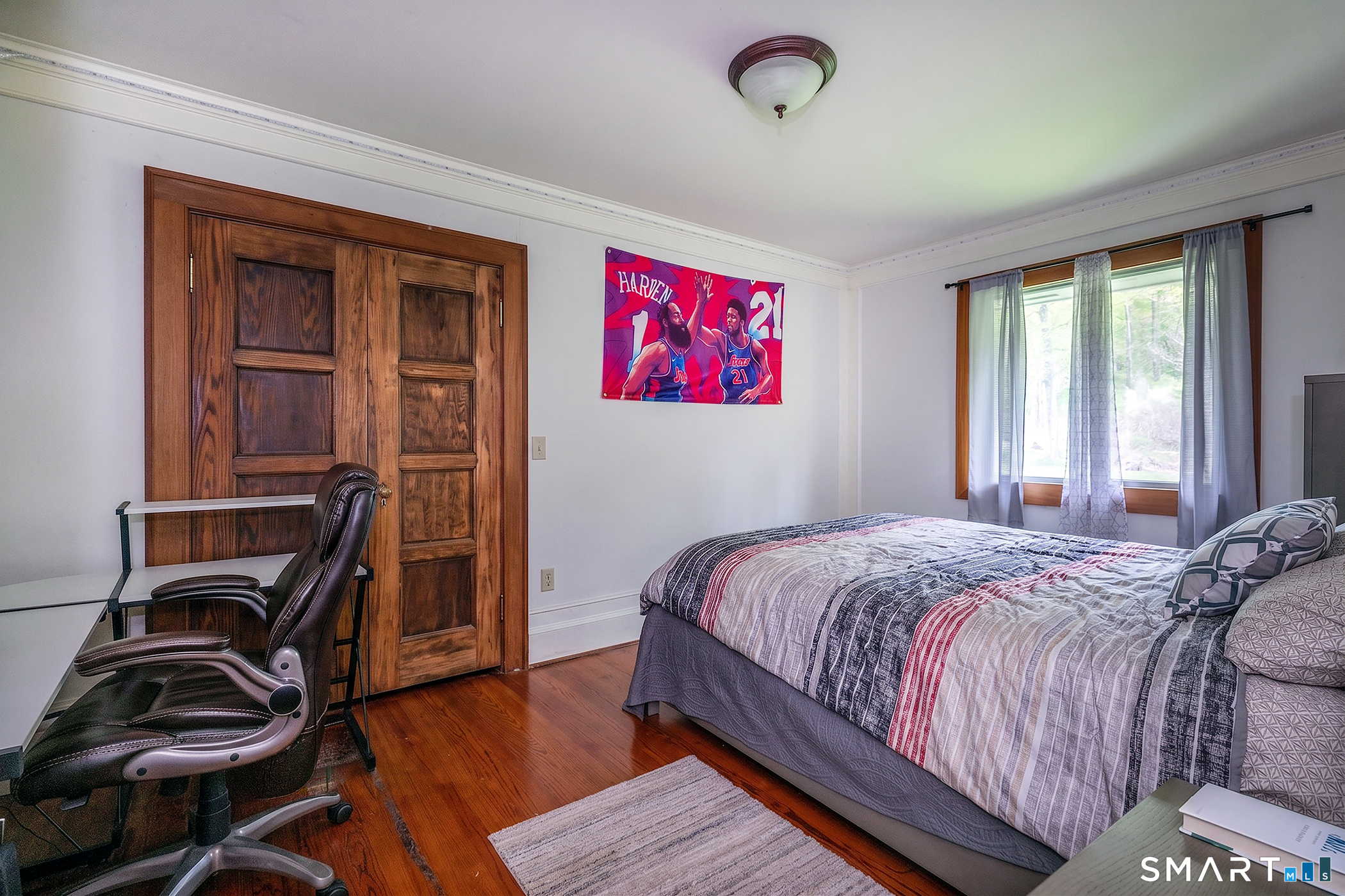 262 Kent Cornwall Road Kent, CT 06757 - Photo 13 of 17 a bed sitting in a bedroom next to a window