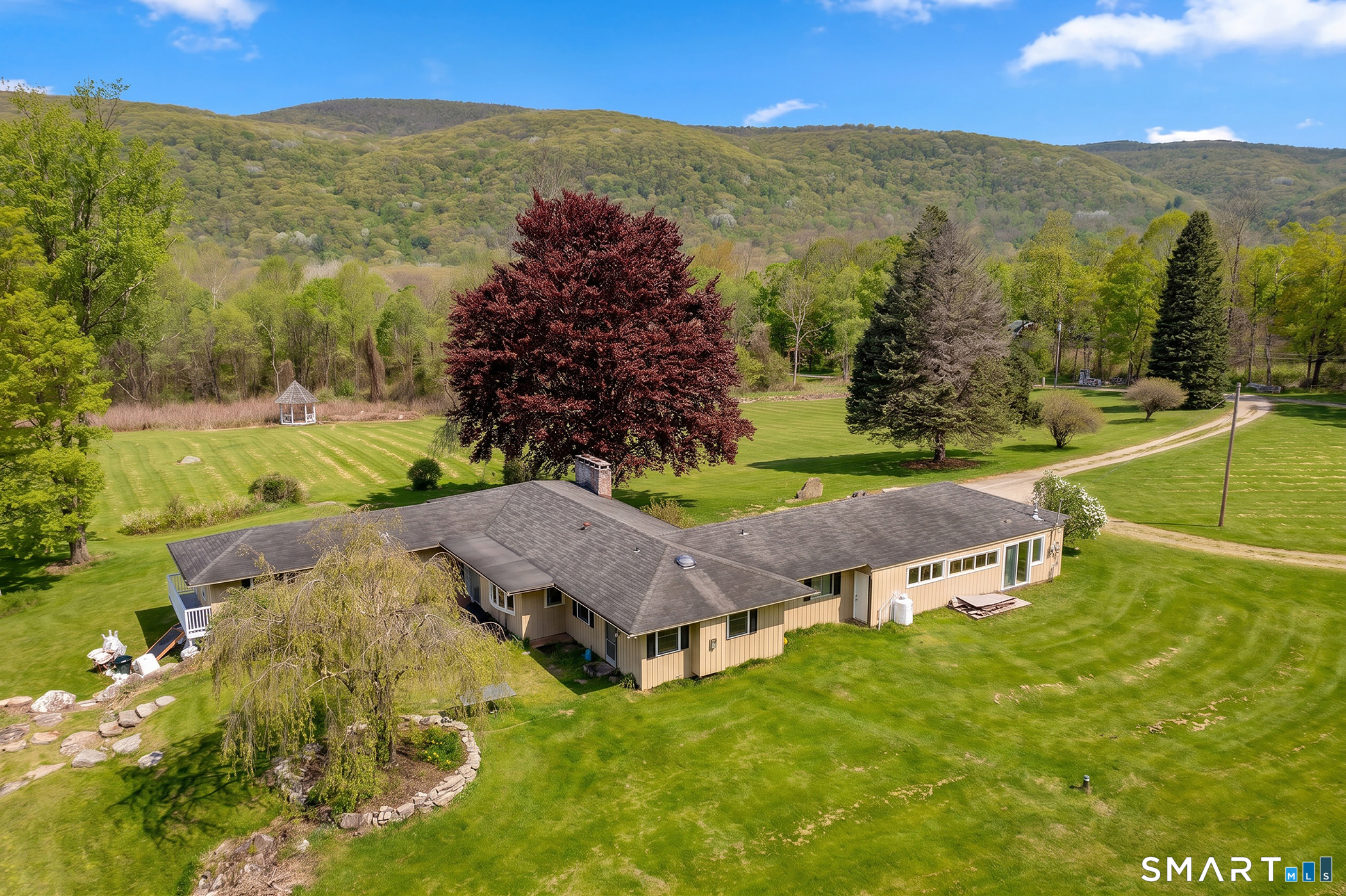 262 Kent Cornwall Road Kent, CT 06757 - Photo 5 of 17 a view of a lush green hillside and houses