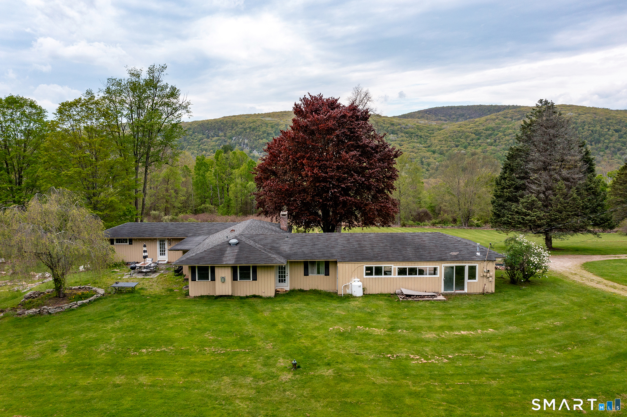 262 Kent Cornwall Road Kent, CT 06757 - Photo 6 of 17 a view of a big house with a big yard and large trees