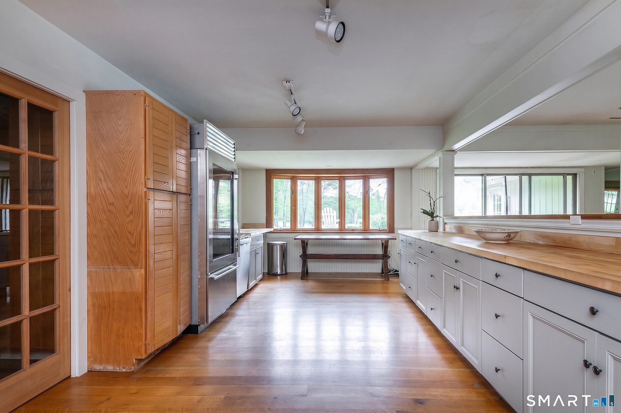 262 Kent Cornwall Road Kent, CT 06757 - Photo 10 of 17 a large space with a large window and wooden floor
