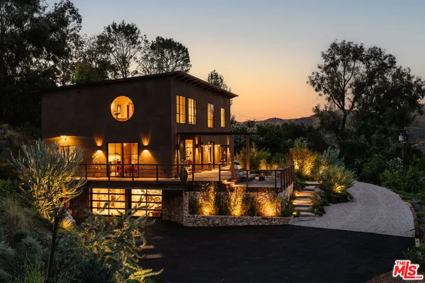 a view of a house with a swimming pool