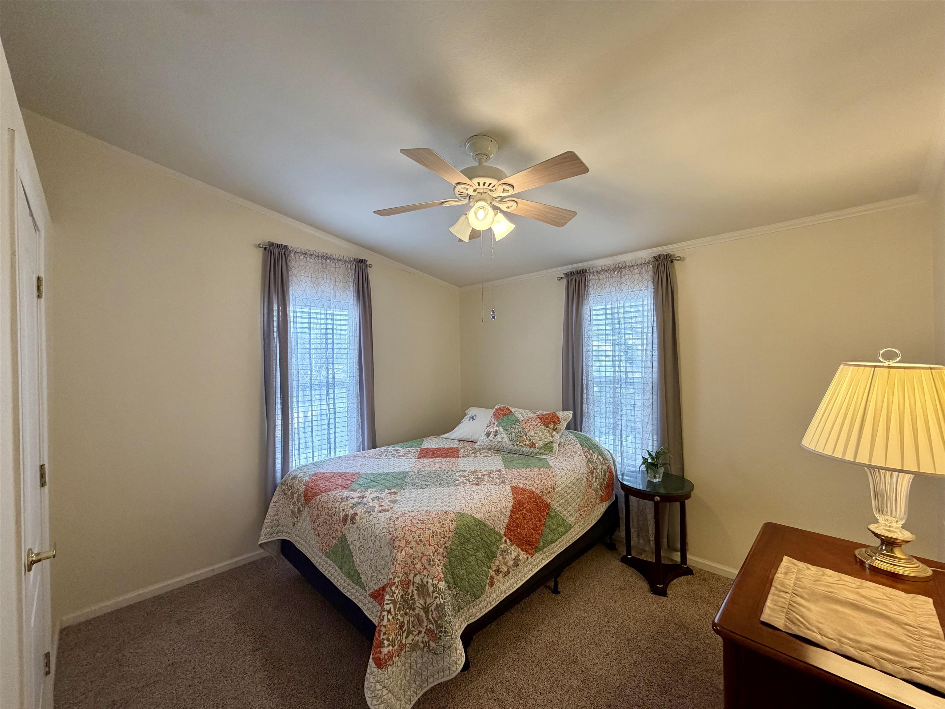 435 32 Road, Unit 480 Clifton, CO 81520 - Photo 18 of 23 a bedroom with a bed and a lamp