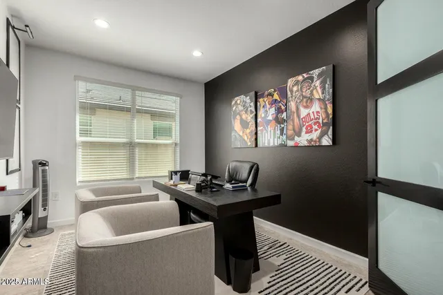 a dining room with furniture and window