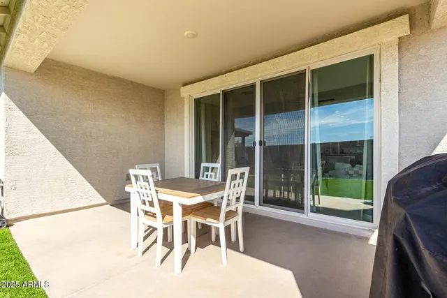 a dining room with a table and chairs