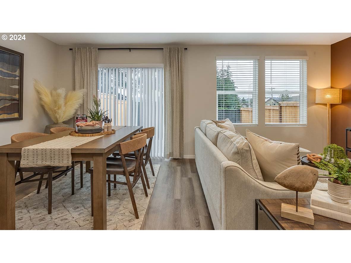 1463 Southeast Pheasant Avenue Gresham, OR 97080 - Photo 12 of 32 a living room with furniture and a large window