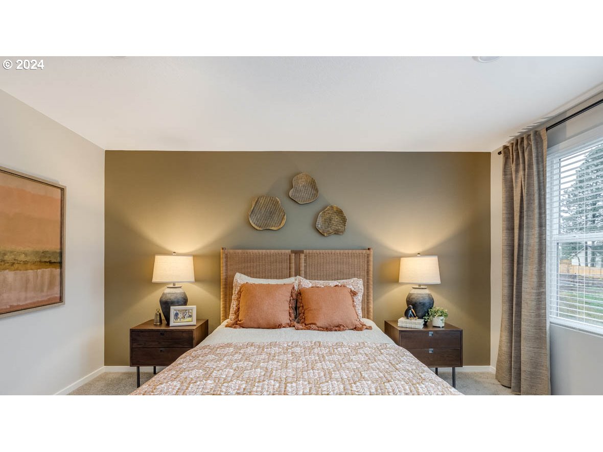 1463 Southeast Pheasant Avenue Gresham, OR 97080 - Photo 20 of 32 a bedroom with a bed and window