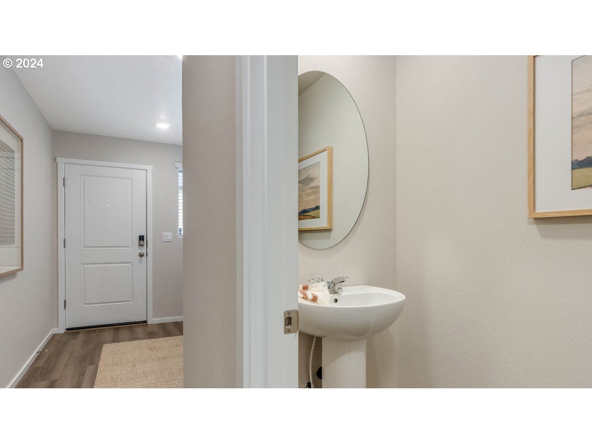 1463 Southeast Pheasant Avenue Gresham, OR 97080 - Photo 3 of 32 a bathroom with a sink and a mirror