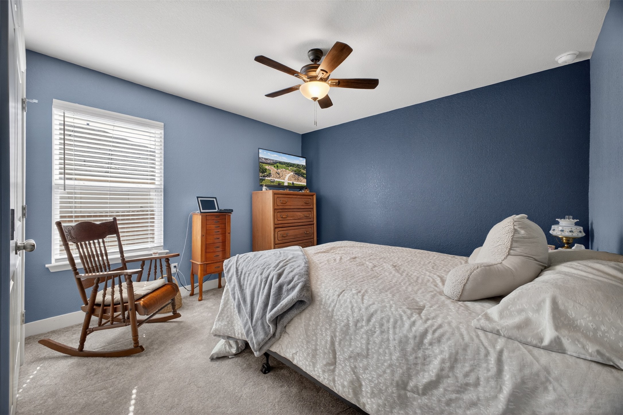 1009 Bright Star Cove Georgetown, TX 78628 - Photo 18 of 40 a bedroom with a bed chair and window
