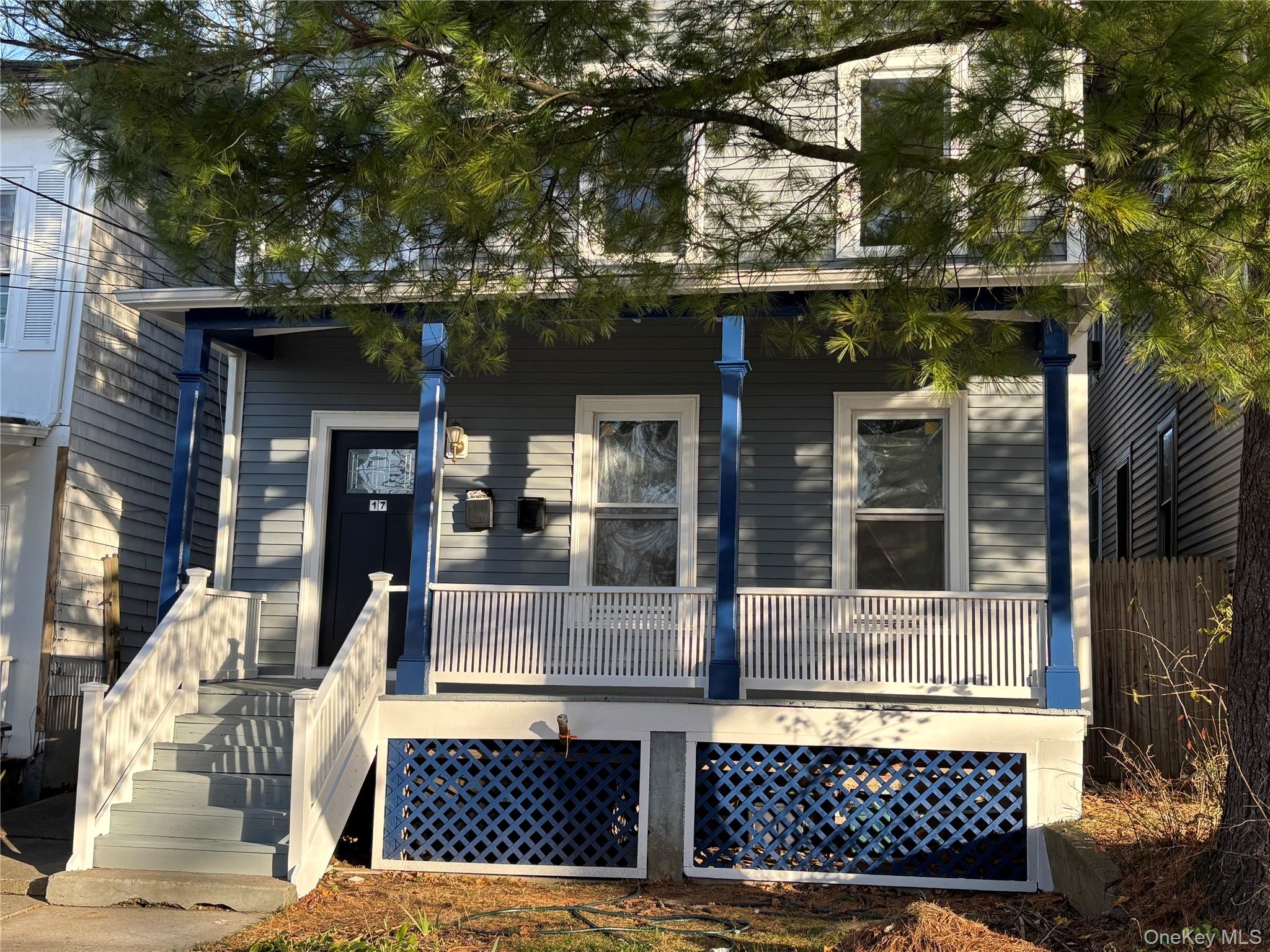 View of front of house with covered porch