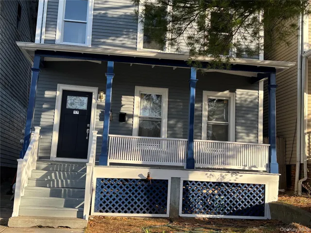 a view of a house with a door and a window