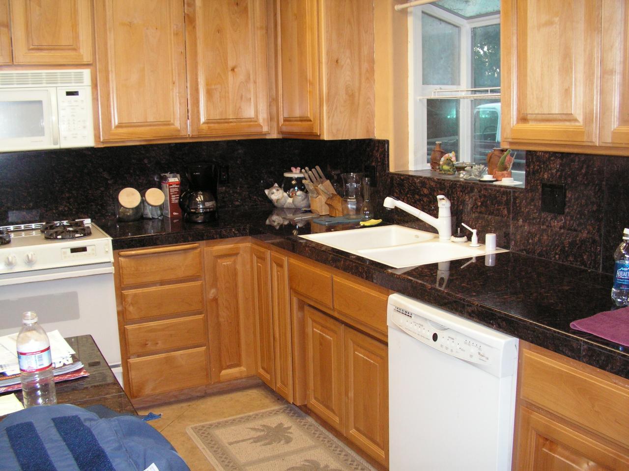 5757 Bell Road Redding, CA 96001 - Photo 5 of 16 a kitchen with granite countertop a sink a stove and cabinets