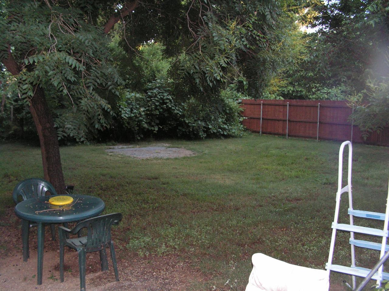 5757 Bell Road Redding, CA 96001 - Photo 8 of 16 a backyard of a house with table and chairs