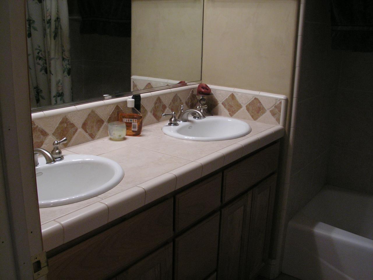 5757 Bell Road Redding, CA 96001 - Photo 10 of 16 a bathroom with a sink and a mirror