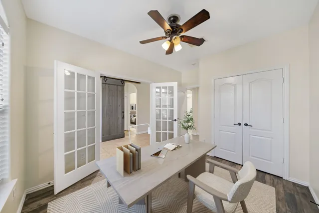 a living room with furniture and a window
