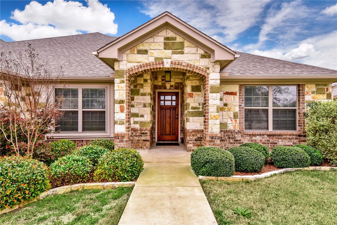 220 Derek Lane Jarrell, TX 76537 - Photo 1 of 1 a front view of a house with garden