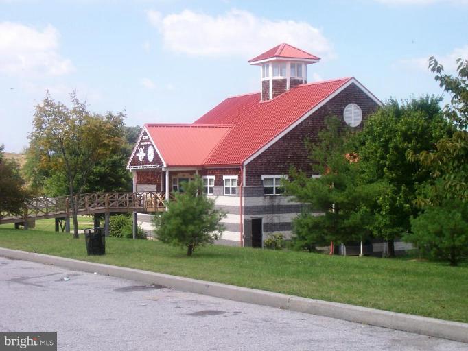 2462 Nevada Street Baltimore, MD 21230 - Photo 20 of 22 a front view of a house with a yard and garage
