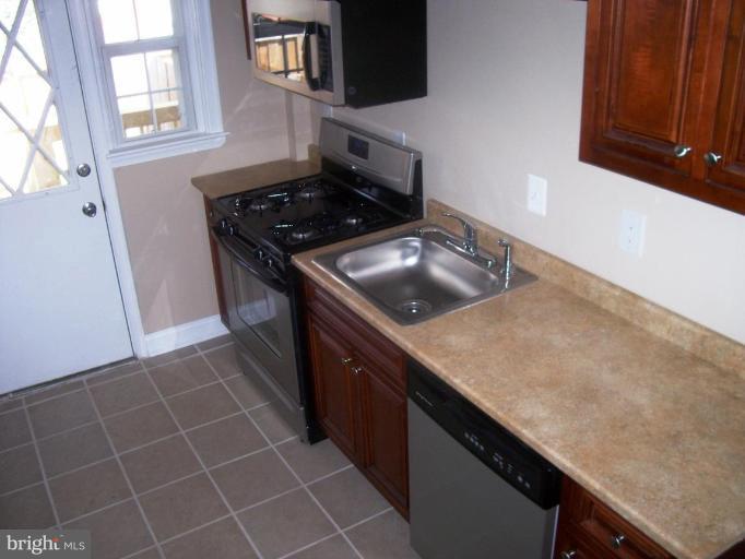 2462 Nevada Street Baltimore, MD 21230 - Photo 7 of 22 a kitchen with a stove and a sink