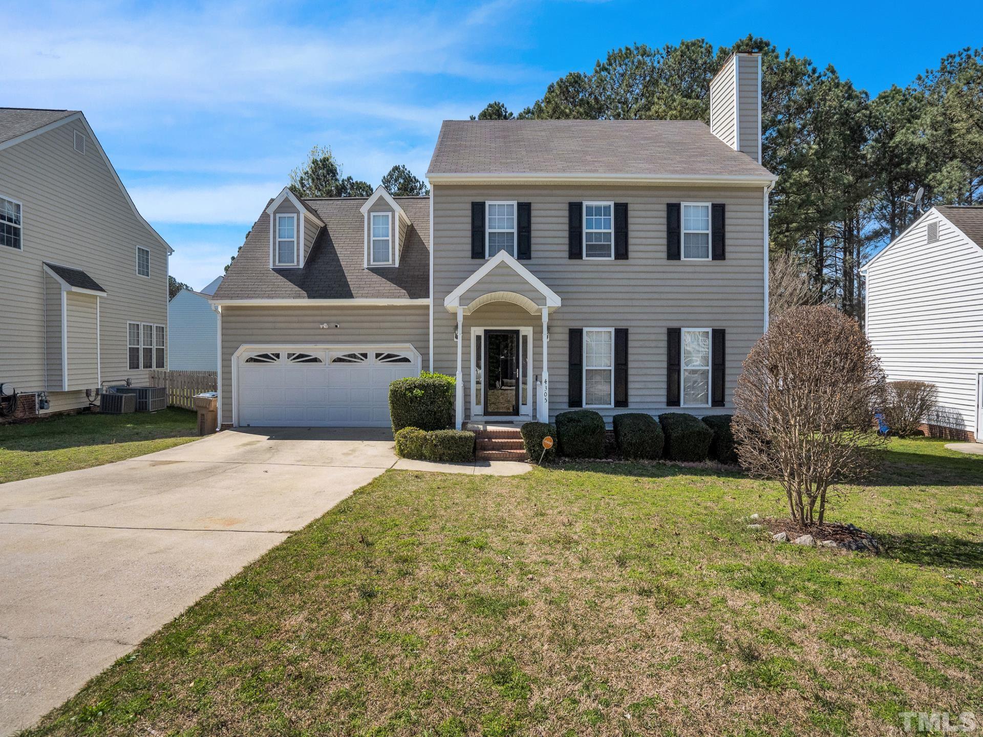 4305 Gallatree Lane Raleigh, NC 27616 - Photo 1 of 21 a front view of a house with a garden and yard