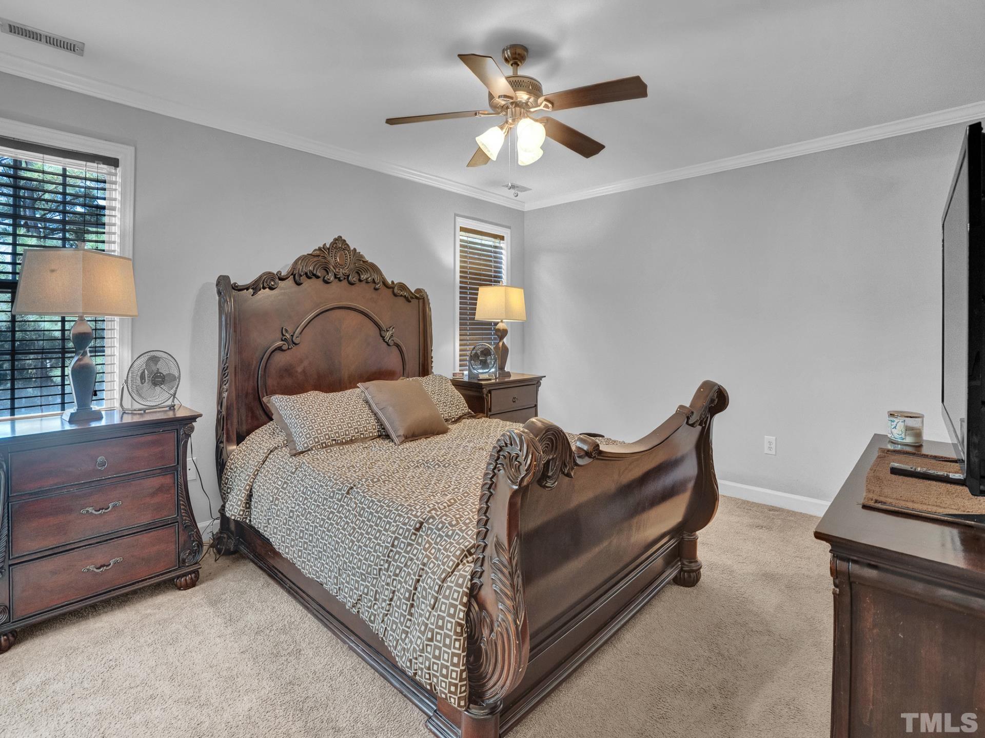 4305 Gallatree Lane Raleigh, NC 27616 - Photo 8 of 21 a bed room with a bed and a chandelier