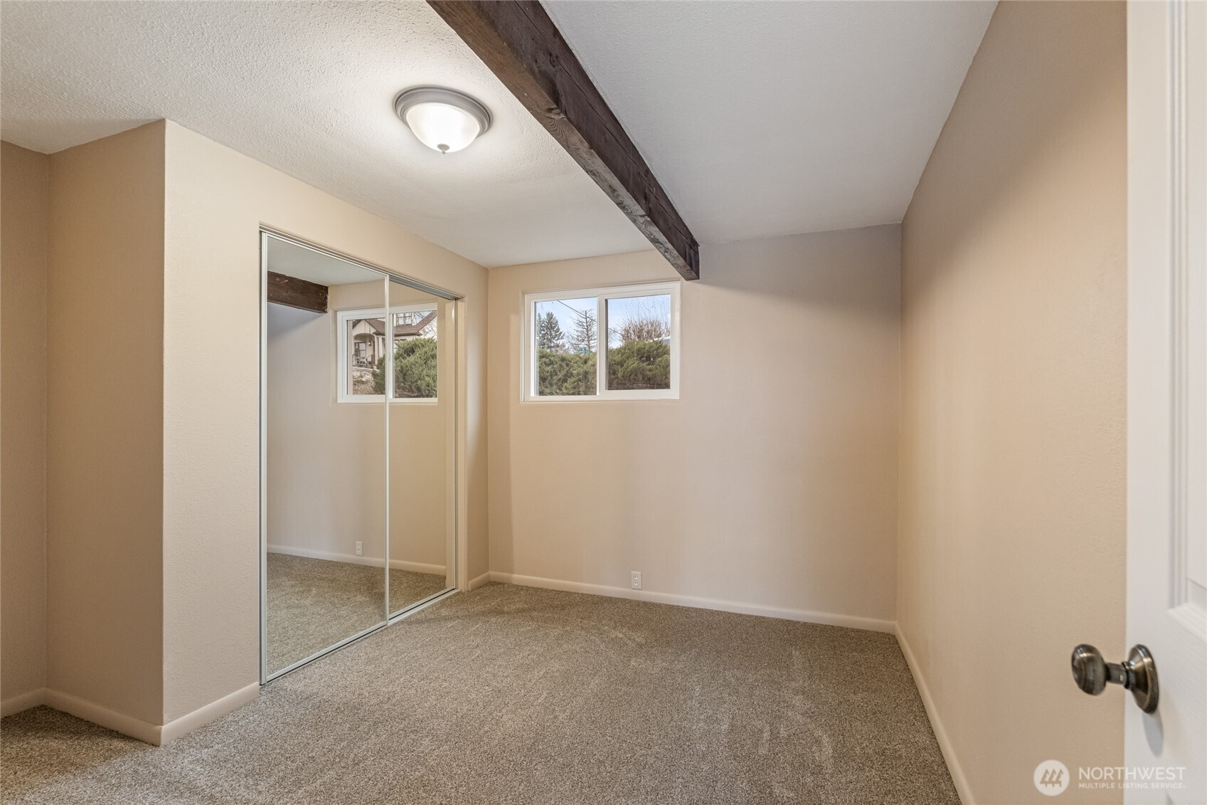 314 West 3rd Street Omak, WA 98841 - Photo 21 of 28 an empty room with windows and closet