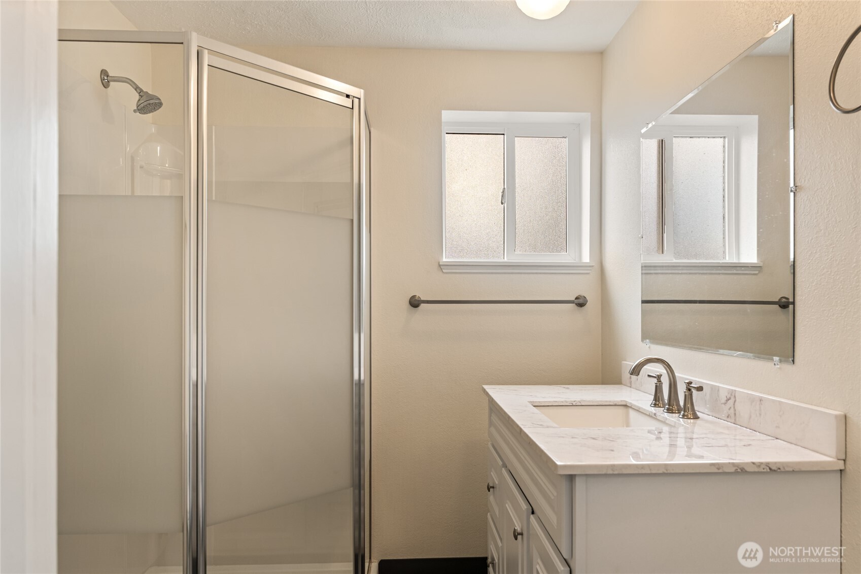 314 West 3rd Street Omak, WA 98841 - Photo 24 of 28 a bathroom with a granite countertop sink and a mirror