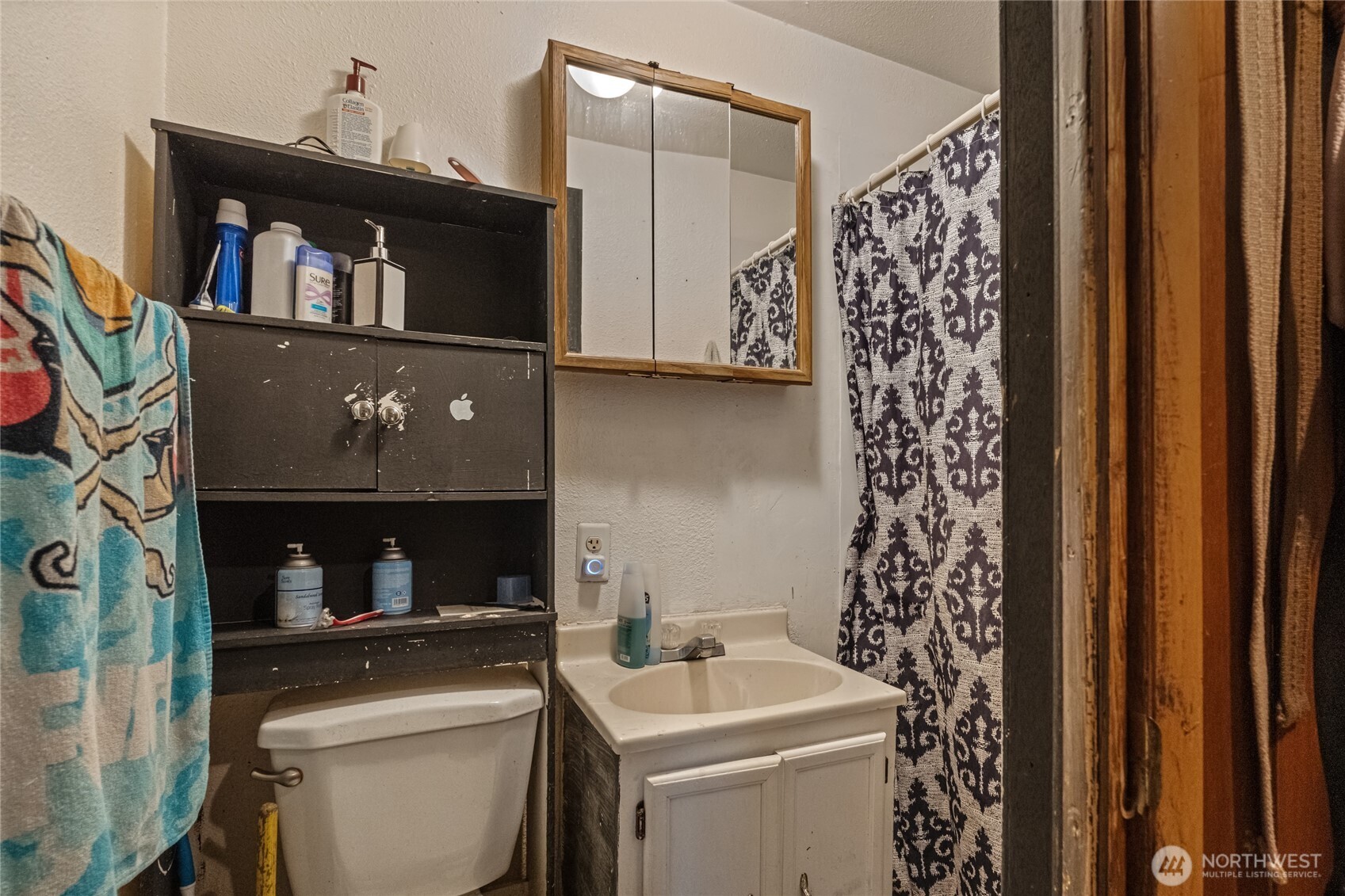 314 West 3rd Street Omak, WA 98841 - Photo 27 of 28 a bathroom with a sink toilet and vanity