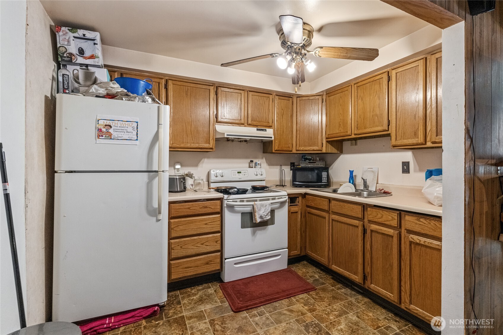 314 West 3rd Street Omak, WA 98841 - Photo 28 of 28 a kitchen with stainless steel appliances granite countertop a refrigerator sink and cabinets