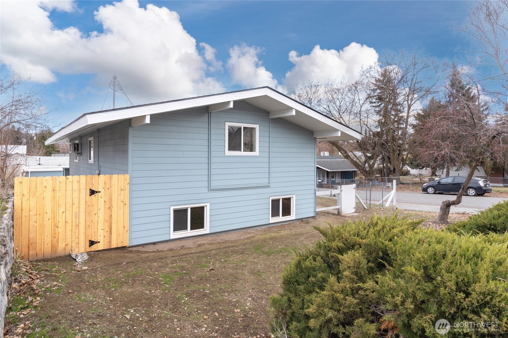 314 West 3rd Street Omak, WA 98841 - Photo 4 of 28 a house that has a tree in front of it
