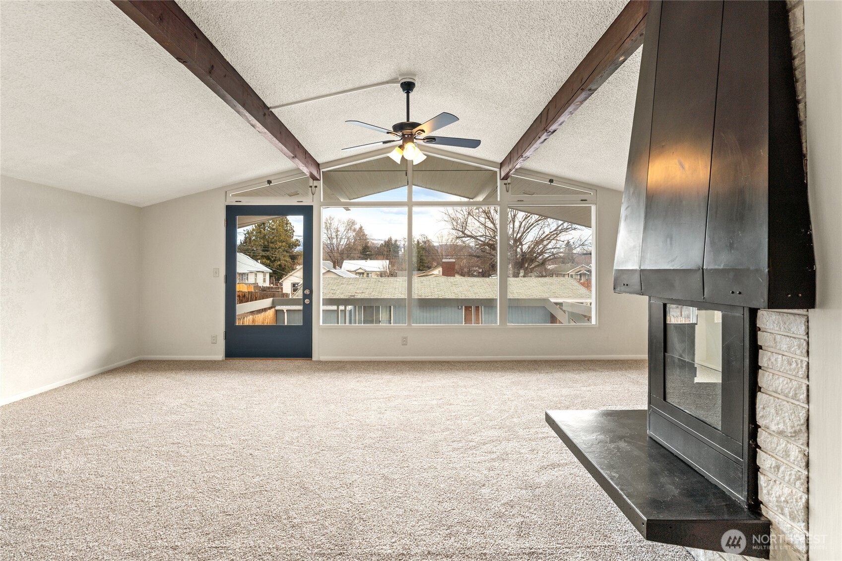 314 West 3rd Street Omak, WA 98841 - Photo 6 of 28 a view of empty room with wooden floor and fan